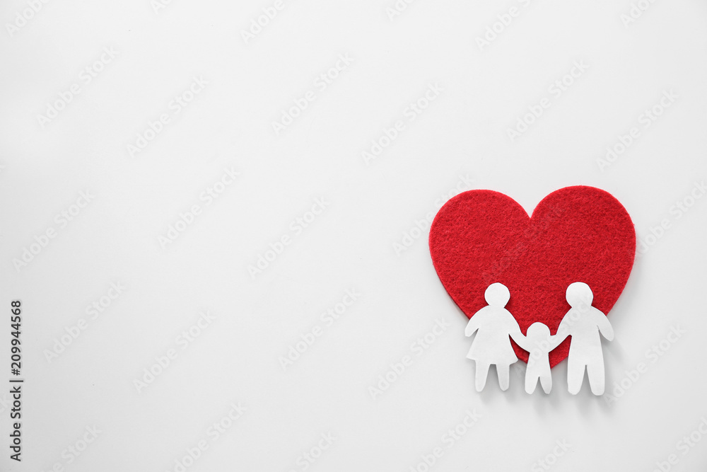 Paper silhouette of people and red heart on light background, top view Paper silhouette of people and red heart on light background, top view