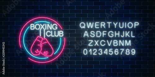Glowing neon boxing club sign with alphabet. Fighting club neon signboard. Nightlife boxing symbol of sport facility