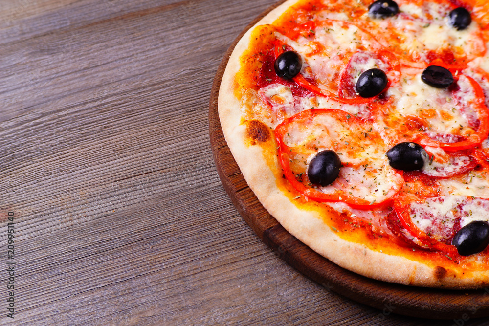 Food background, sicilian pizza with ham and black olives close up with free space. Traditional Italian recipe, delivery, restaurant, pizzeria menu concept