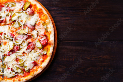 Food background, pizza close up with free space. Traditional Italian Napoli recipe, delivery, restaurant, pizzeria menu concept