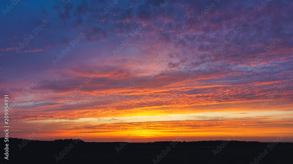 Sunrise . Sunset or sunrise with clouds, light rays and other atmospheric effect . Light from sky . 