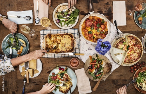 Canvas Print Dinner party with homemade lasagna and quiche
