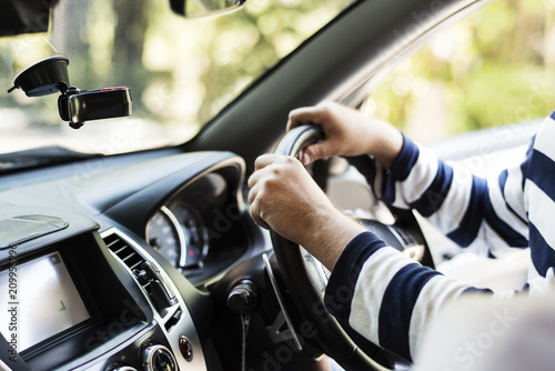 Man driving a family car