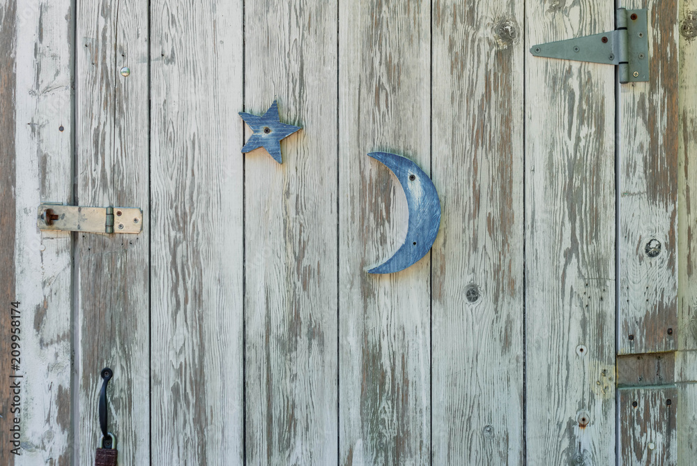 Rustic white washed door with blue moon and star Rustic white washed door with blue moon and star