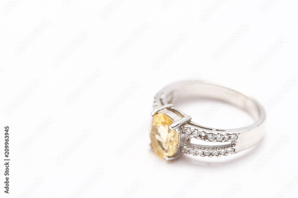 Yellow gem stone on diamond ring Yellow gem stone on diamond ring
