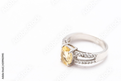 Yellow gem stone on diamond ring