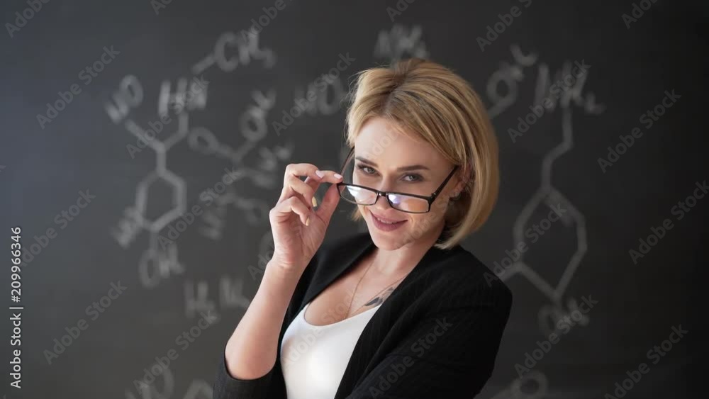 Learn science or chemistry formula confident beautiful woman teacher chalk blackboard background Learn science or chemistry formula confident beautiful woman teacher chalk blackboard background