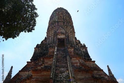 Travel Thailand - Pagoda in Wat Chaiwatthanaram on blue sky and cloud background  Ayutthaya Historical Park. The brick pagoda at old ayutthaya temple ruins. Space for text in template.