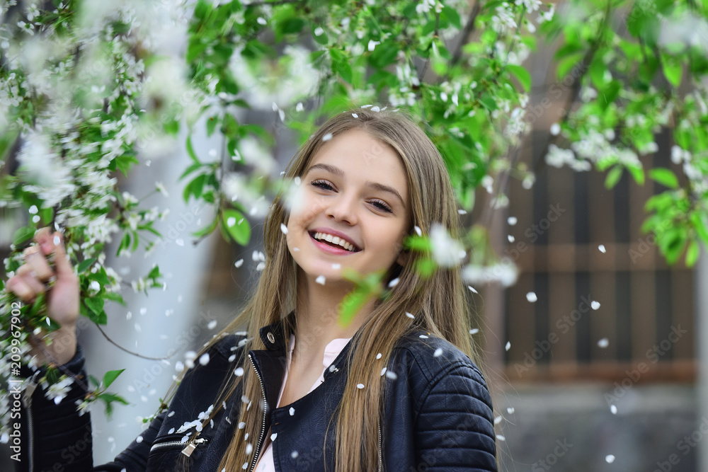 spring blooming concept.spring girl in blossom tree with happy face. spring blooming concept.spring girl in blossom tree with happy face.
