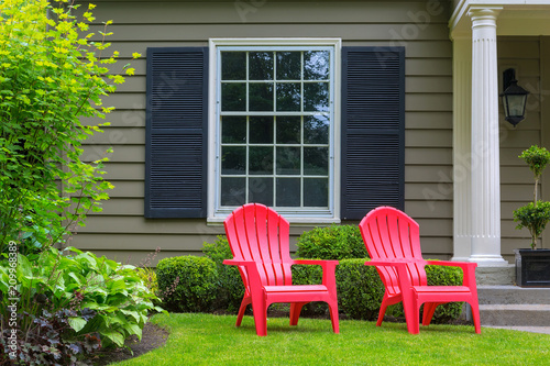Red Outdoor patio Chairs on Front Yard Lawn photo