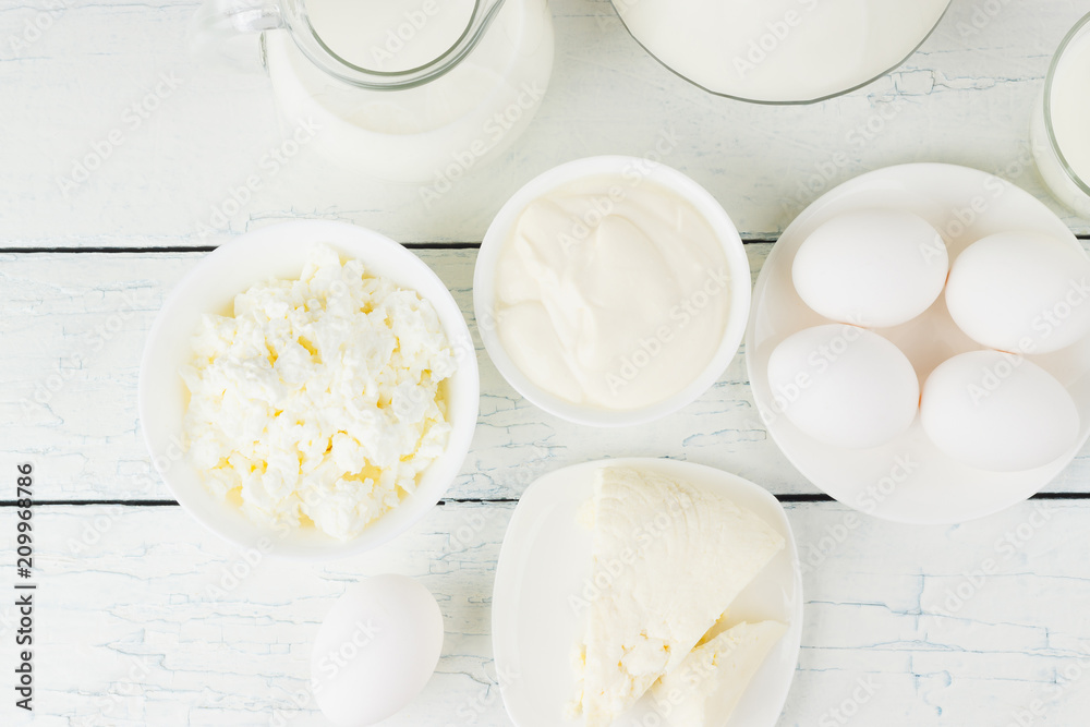 Different dairy products on the white wooden background Different dairy products on the white wooden background
