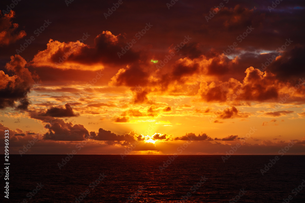 Beautiful sunset in atlantic ocean with amazing clouds