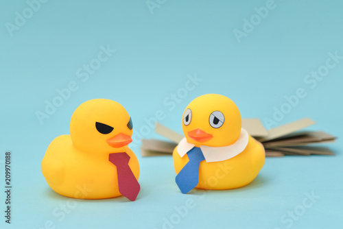 Office life concept, rubber duck and demanding boss   © niradj