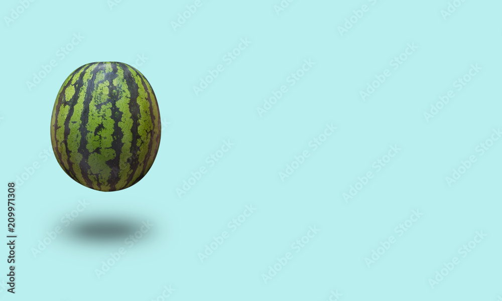 Watermelon isolated on a blue pastel background with a shadow Watermelon isolated on a blue pastel background with a shadow