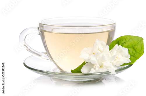 Glass cup of Tea with jasmine flowers isolated on white background
