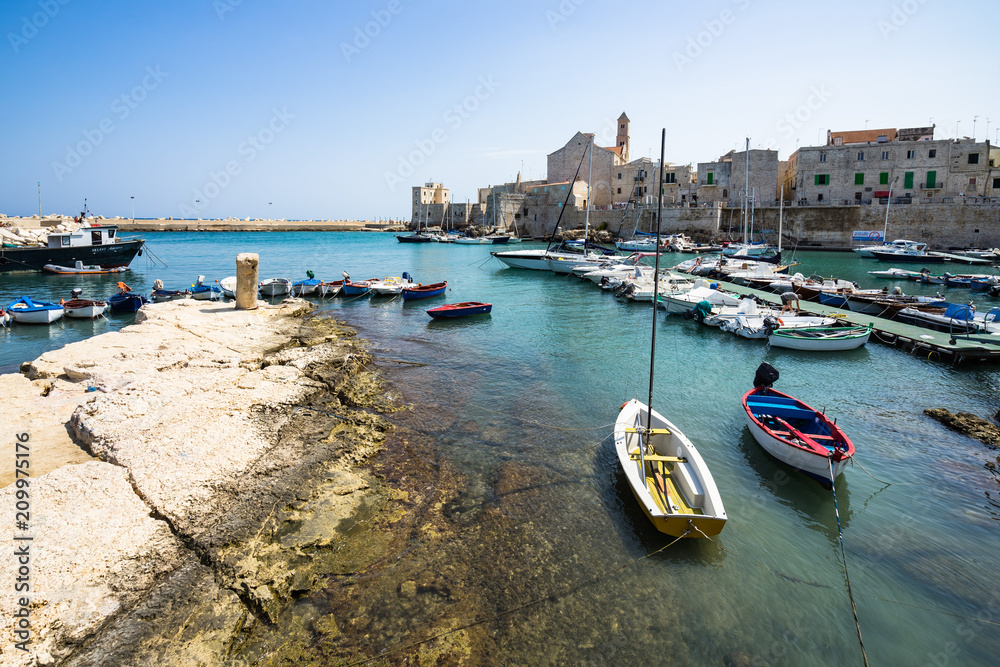 Beautiful view of Giovinazzo port with colorful fishing boats, Apulia, Italy