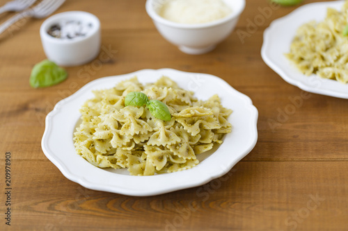 Pasta Farfalle in pesto sauce with Basil and Parmesan.
