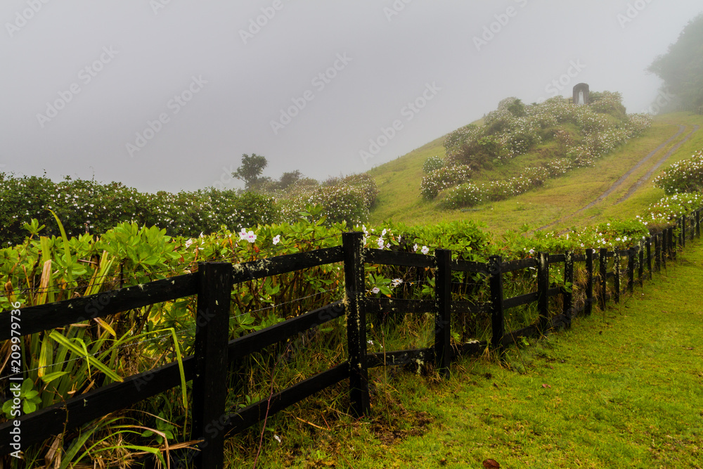 Misty view of a fence in the mountains, Panama.
