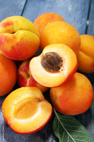 Delicious ripe apricots on wooden table. Fresh cut apricot fruits