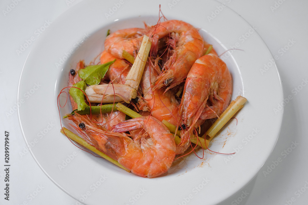 Baked Shrimp on a plate on white background Baked Shrimp on a plate on white background