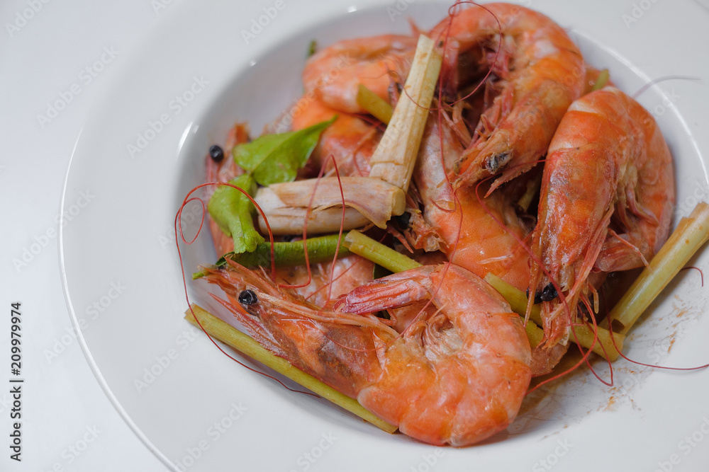 Baked Shrimp on a plate on white background Baked Shrimp on a plate on white background