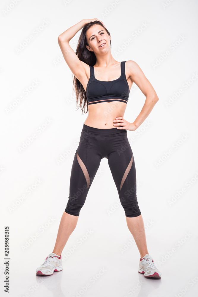 Sporting girl is engaged in fitness on a white background Sporting girl is engaged in fitness on a white background