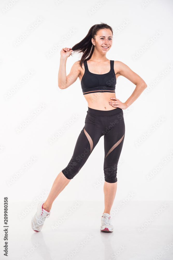 Sporting girl is engaged in fitness on a white background Sporting girl is engaged in fitness on a white background