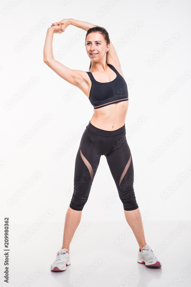 Sporting girl is engaged in fitness on a white background Sporting girl is engaged in fitness on a white background