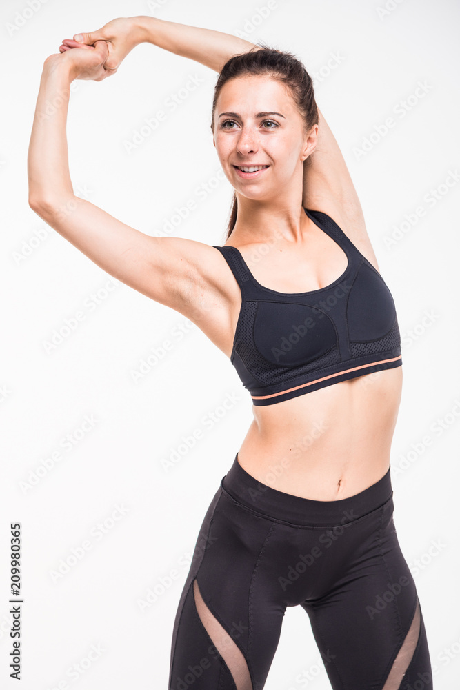Sporting girl is engaged in fitness on a white background Sporting girl is engaged in fitness on a white background