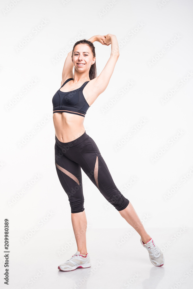 Sporting girl is engaged in fitness on a white background Sporting girl is engaged in fitness on a white background