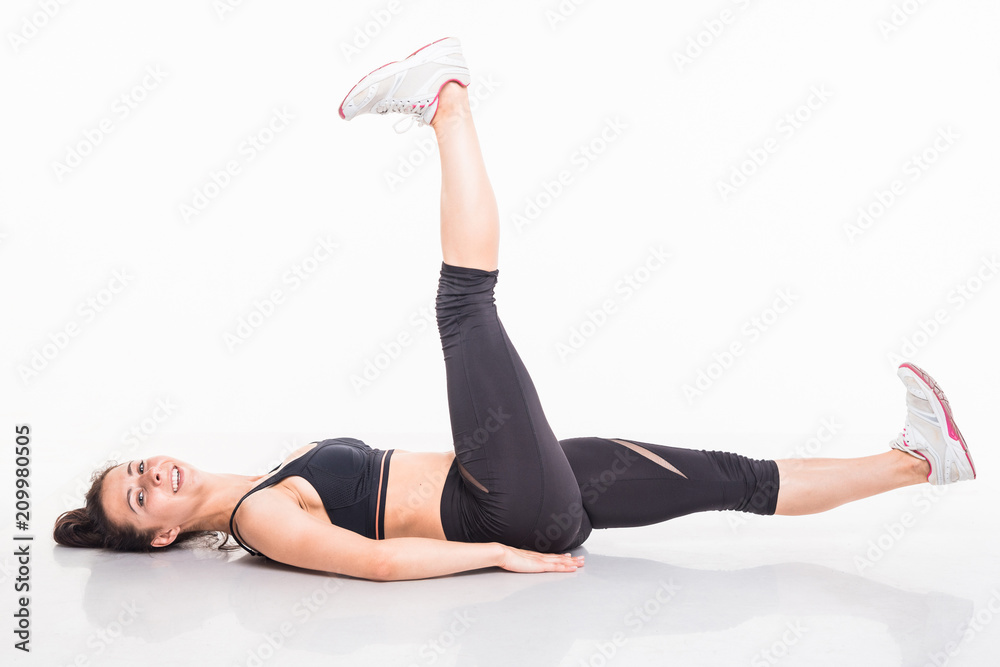 Sporting girl is engaged in fitness on a white background Sporting girl is engaged in fitness on a white background