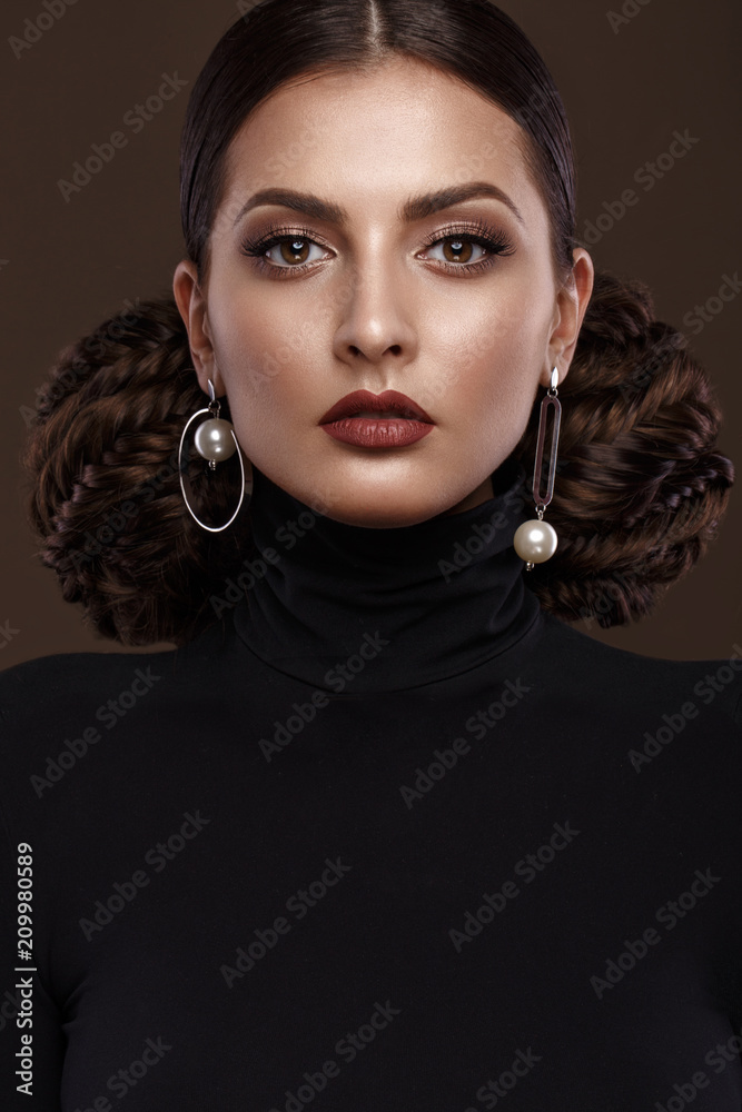 Pretty girl with unusual hairstyle, bright makeup, red lips. Beauty face. Studio portrait Pretty girl with unusual hairstyle, bright makeup, red lips. Beauty face. Studio portrait