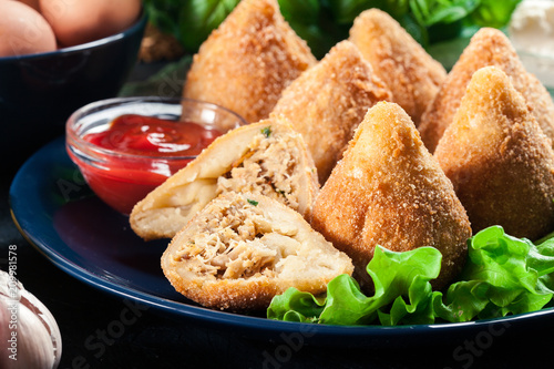 Coxinha. Fried croquette with chicken photo