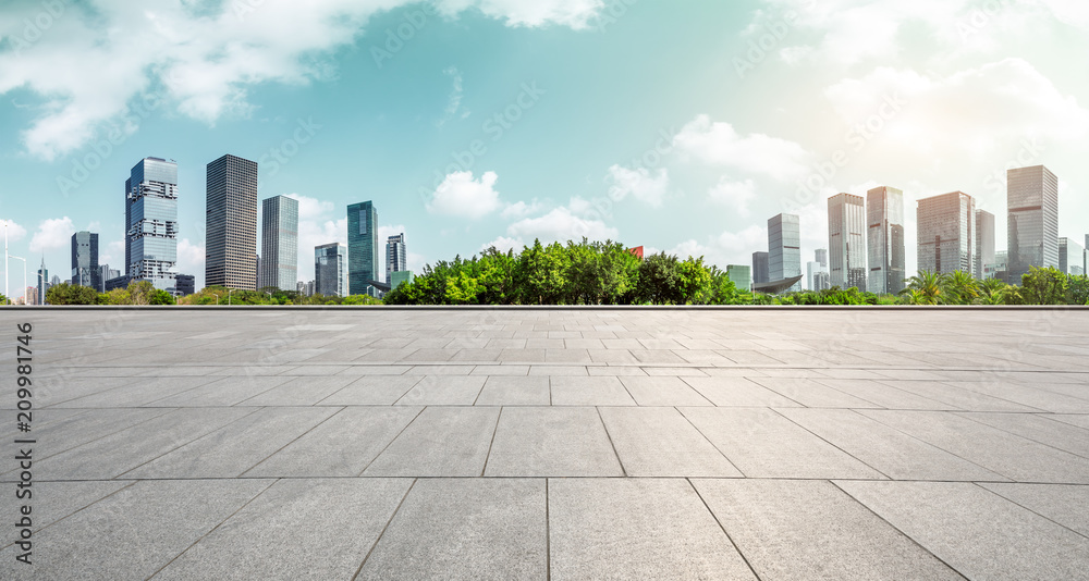 Empty square floor and modern city commercial architecture panorama in shenzhen,China