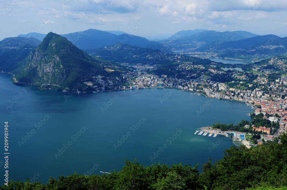 Switzerland: Lugano City with Mount San salvatore seen from Monte Bré