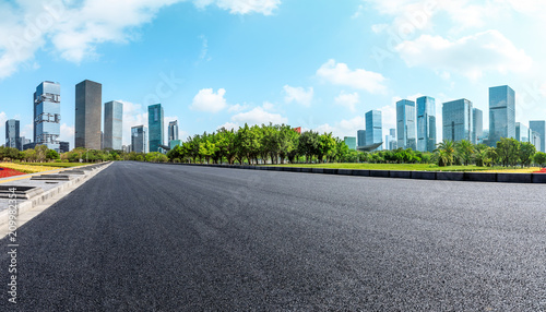 Empty asphalt road and modern city commercial buildings panorama in shenzhen,China