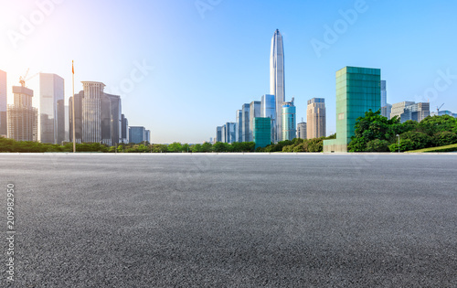 Asphalt road and modern city commercial buildings panorama in Shenzhen