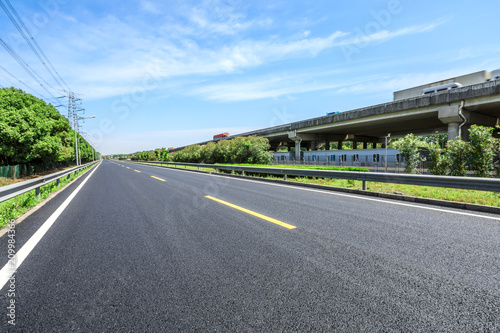 Empty asphalt highway and bridge building