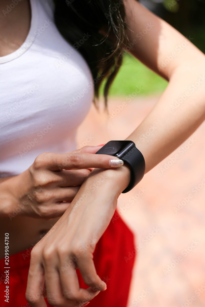 Health sport young woman look wear smart watch device checking performance, Sport and fitness  concept.