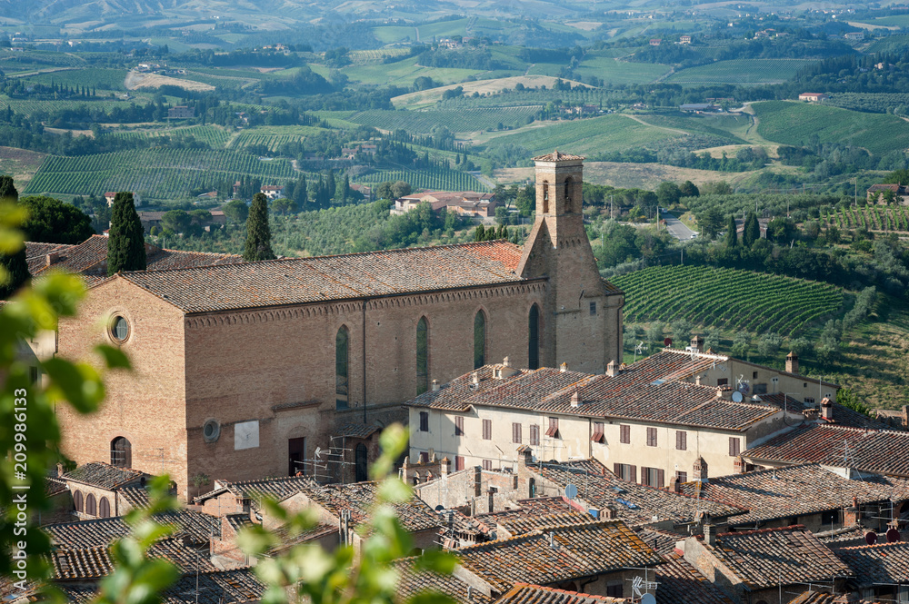 A Tuscan landscape with Sant'Agostino church (1280 ca.) in San Gimignano, Italy