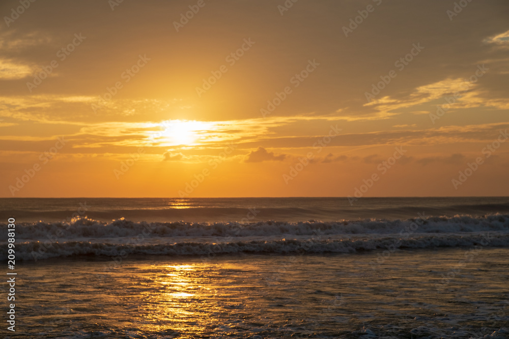 Beautiful golden sunrise at the sea