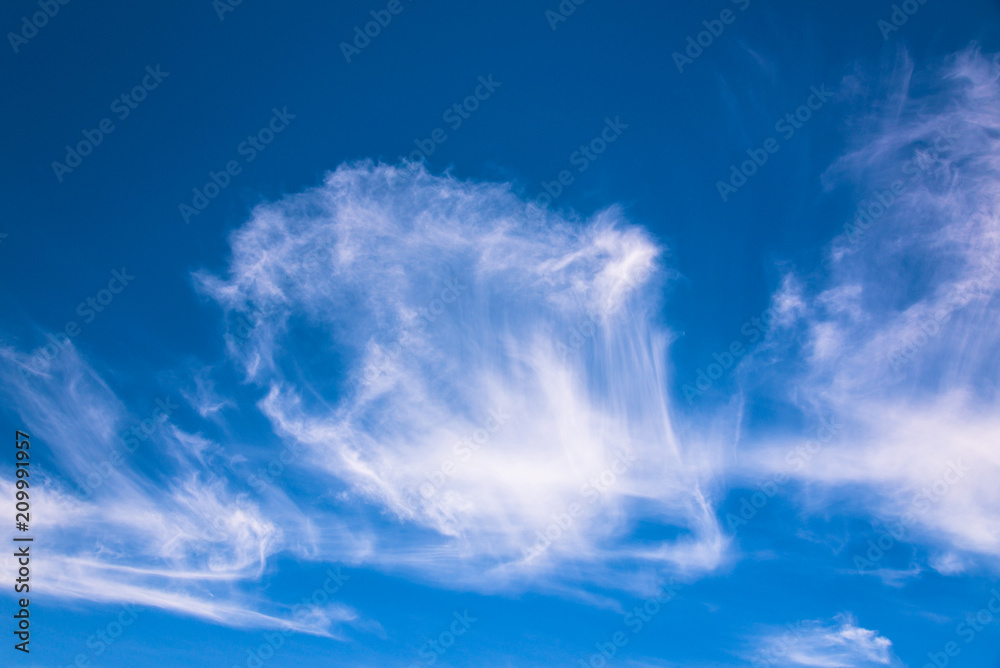 Fototapeta premium Spindrift clouds on blue sky