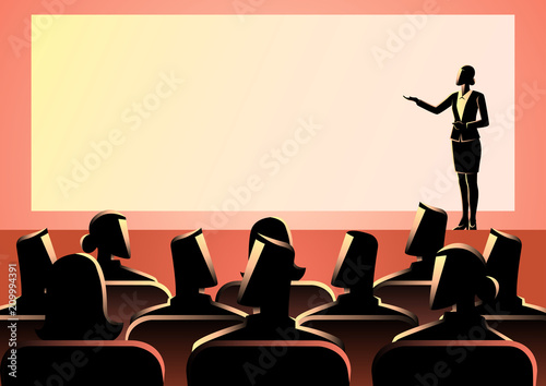 Businesswoman giving a presentation on big screen