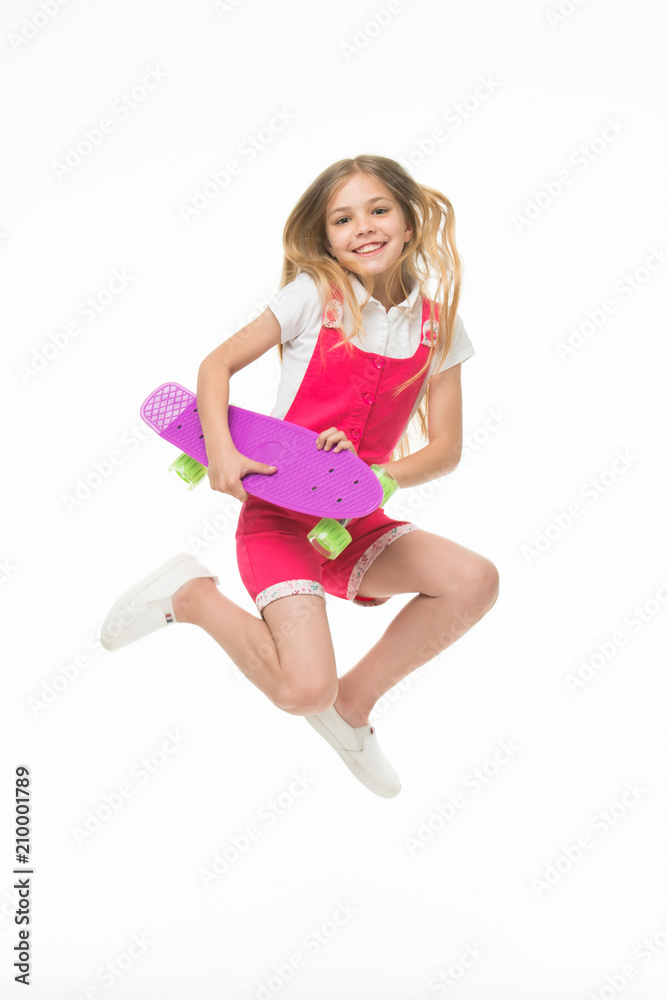 Happy child jump with penny board isolated on white. Little kid smile with skateboard. Fun in motion. Sense of freedom. Childhood development. Carefree skater girl. Active hobby and sport activity Happy child jump with penny board isolated on white. Little kid smile with skateboard. Fun in motion. Sense of freedom. Childhood development. Carefree skater girl. Active hobby and sport activity