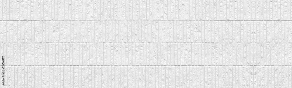Fototapeta premium Panorama of Modern white stone tile wall background and pattern