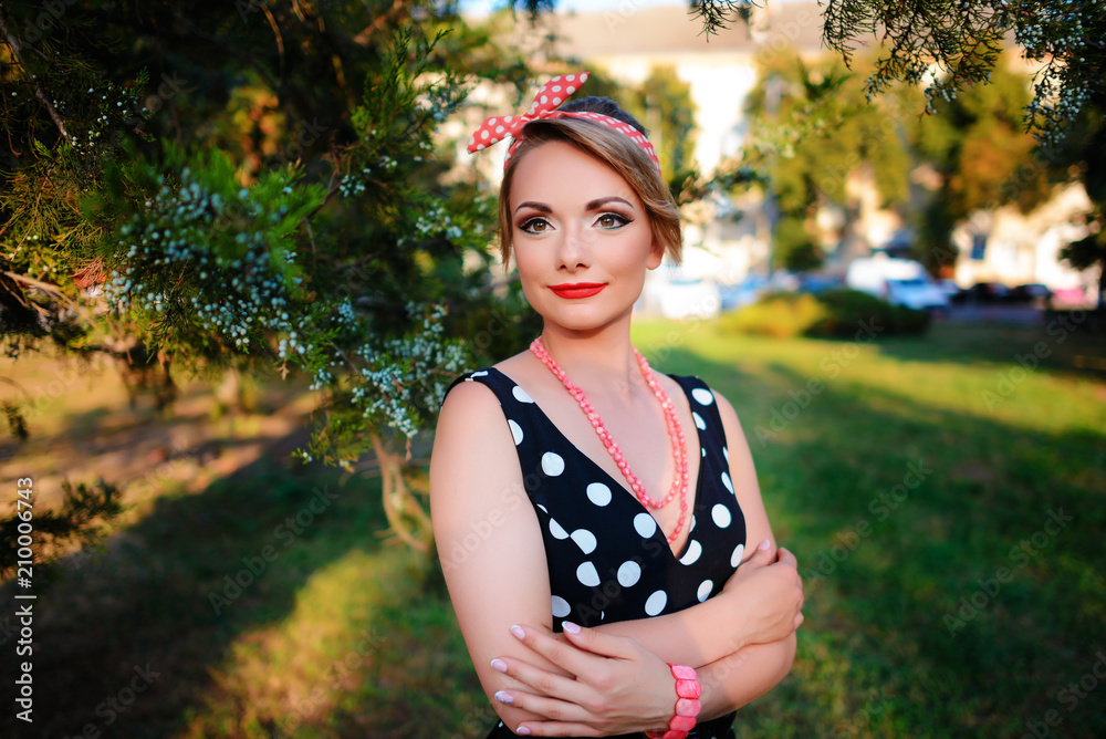 young beautiful caucasian woman posing in a dress