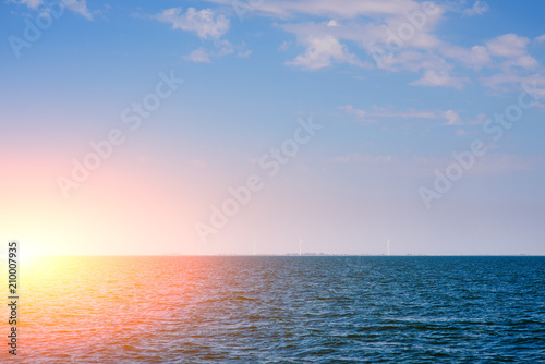 the blue ocean with dull clouds on a lovely sunny day