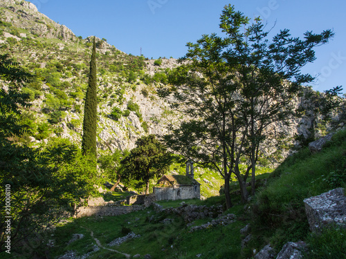 Abandoned ancient chapel in the mountains, behind Kotor fortress. Montenegro, Kotor photo