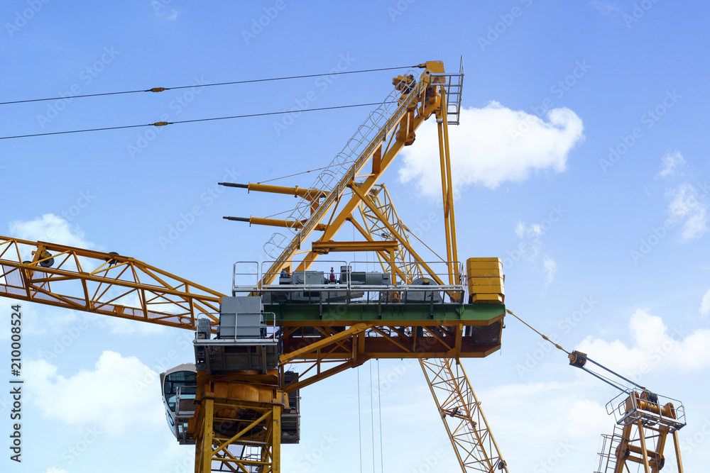 Tower crane with blue sky background Tower crane with blue sky background
