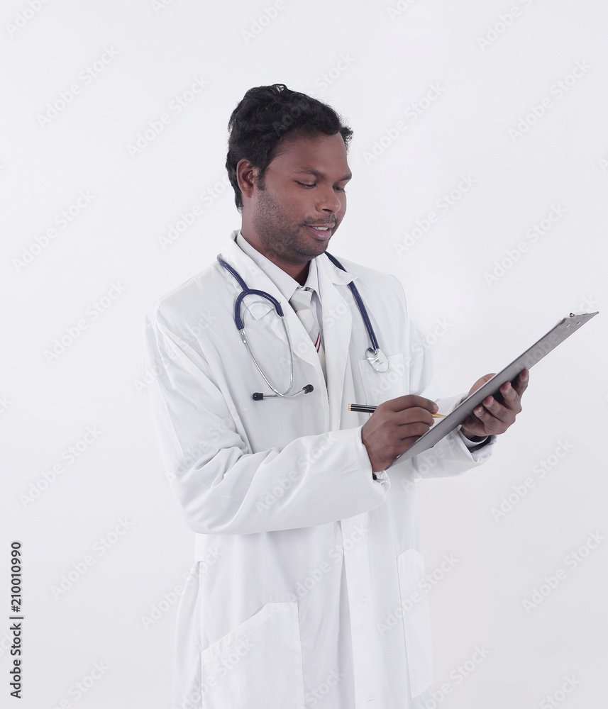 General practitioner writing a prescription for a patient General practitioner writing a prescription for a patient